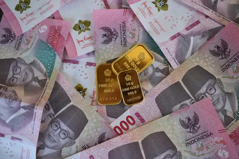 Gold bars on international currency representing portfolio diversification