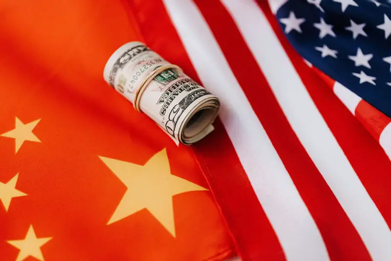 US Dollar bills on flags representing currency markets